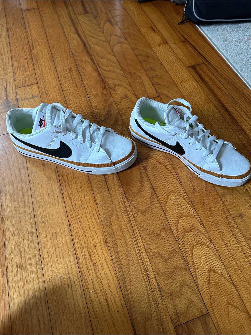 Nike Women’s White Low-Top Sneakers with Black Swoosh and Tan Trim